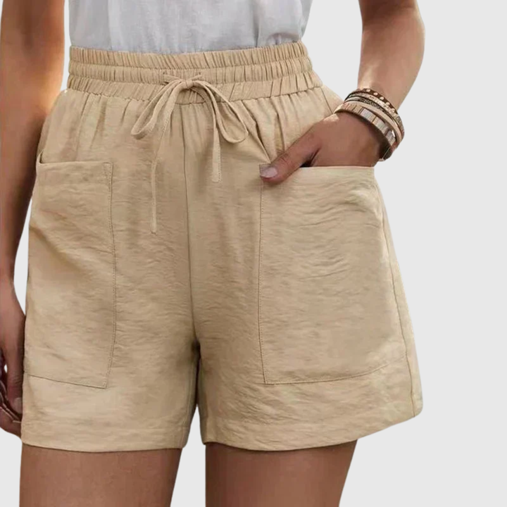 Beige damshorts med elastisk midja och praktiska framfickor
