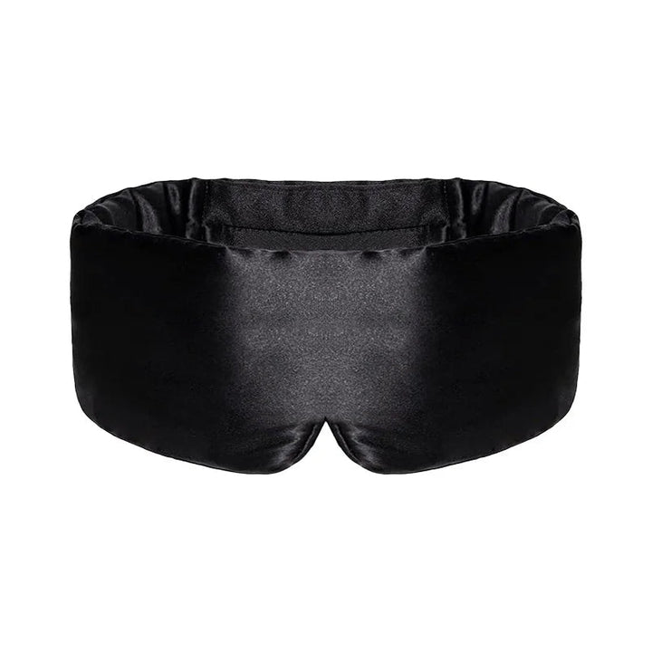 Svart sovmask med mjuk design mot ljusa bakgrunder