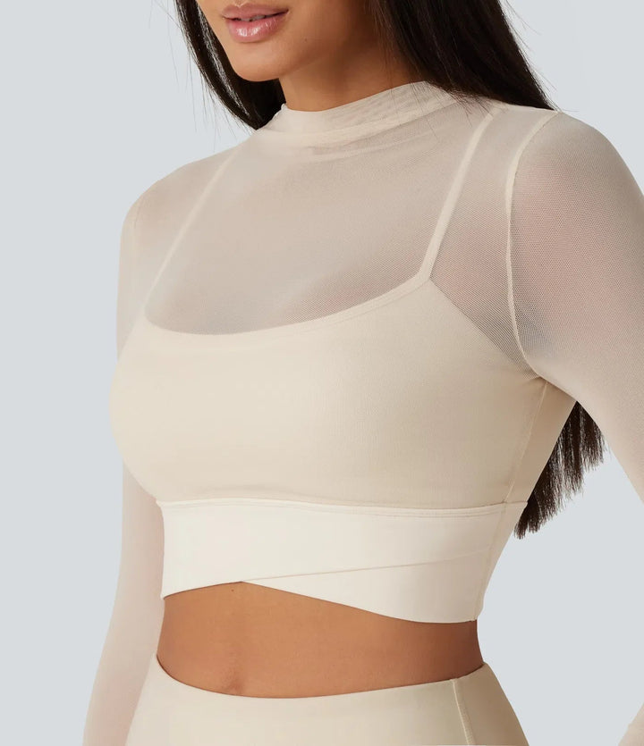 Moderna träningskläder: crop top i mesh med långa ärmar