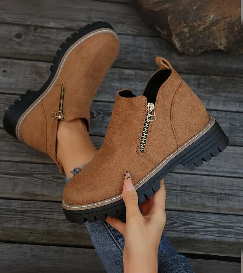 Sula och klackdetalj på gröna dam ankelboots