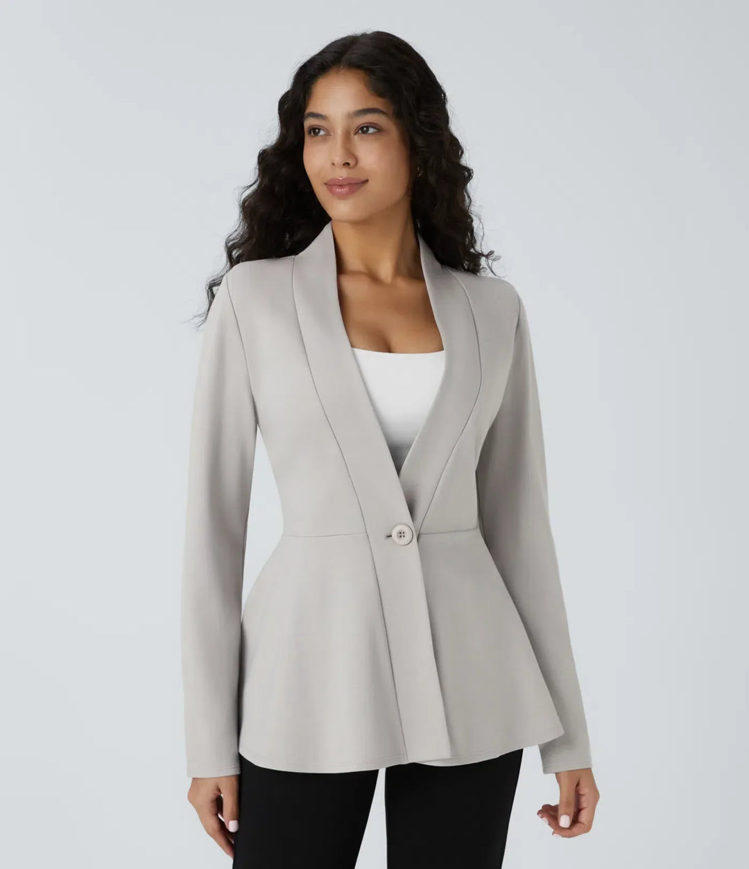 Snygg och bekväm damjacka med v-ringad hals och dekorativ peplum