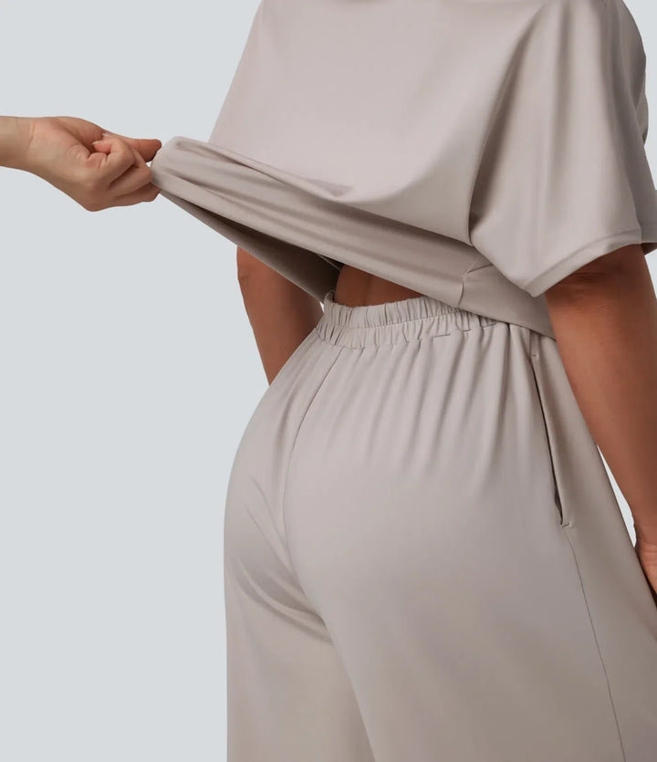 Elegant enaxlad damjumpsuit i sommarstil med praktiska fickor