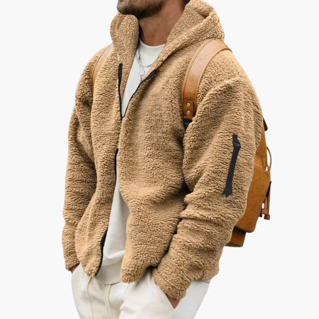 Närbild på texturerat fleecetyg och dragkedja på herrjacka