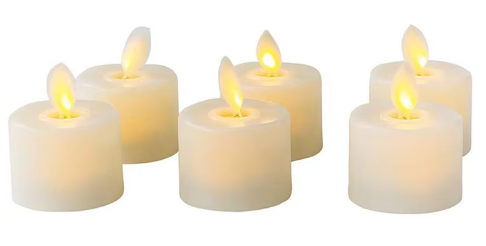 Närbild på tre tända LED-ljus som avger ett varmt sken