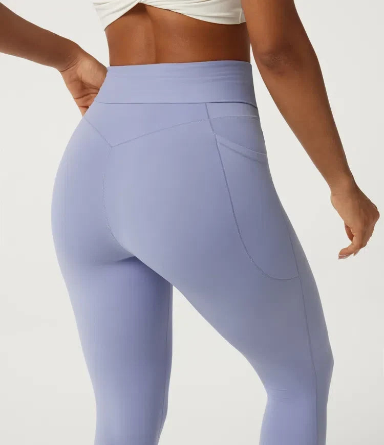 Mjukt tyg på dam yogaleggings med hög midja och fickor för träning
