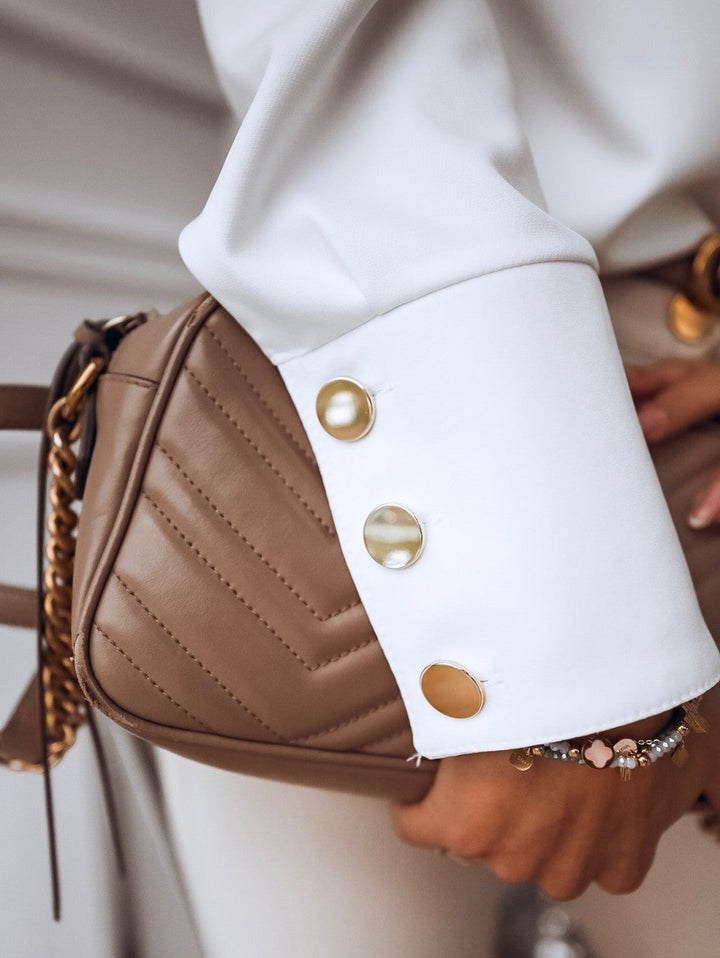 Elegant långärmad damblus i vardagsmodell med snygga metallknappar