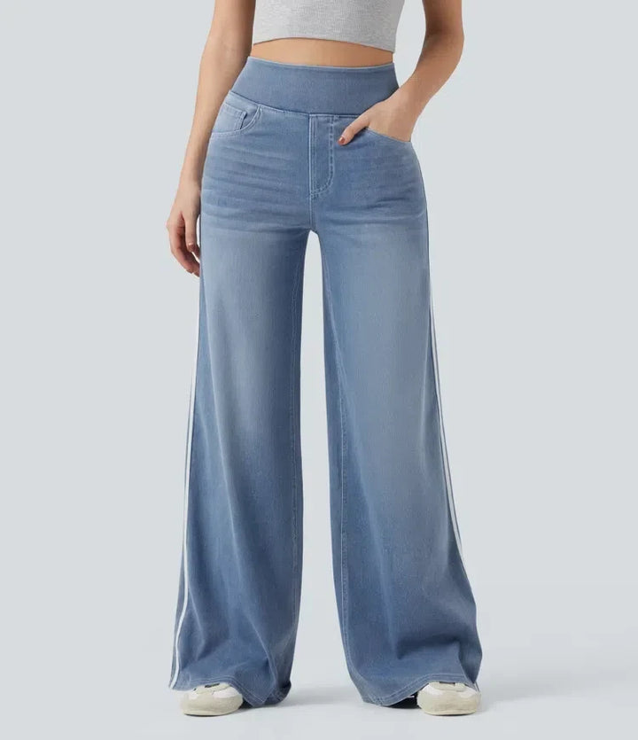 Framifrån på damvida jeans med vida ben och sidoränder