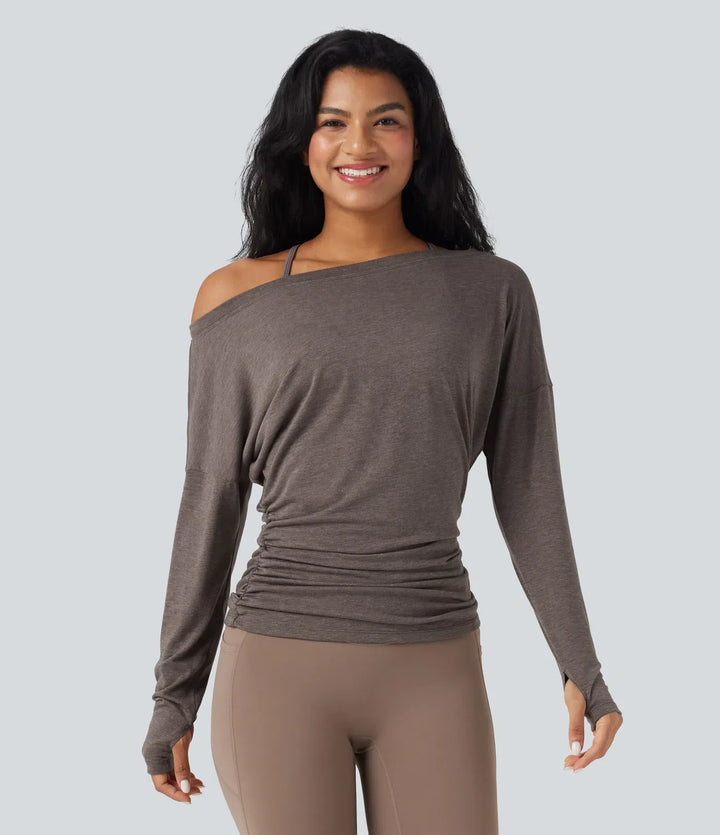 Modern yogatop och sporttopp med unik enaxlad design