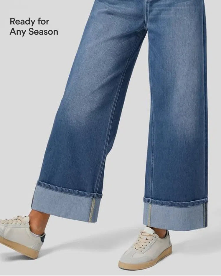 Beiga stretchjeans med vida ben och trendig upprullad fåll