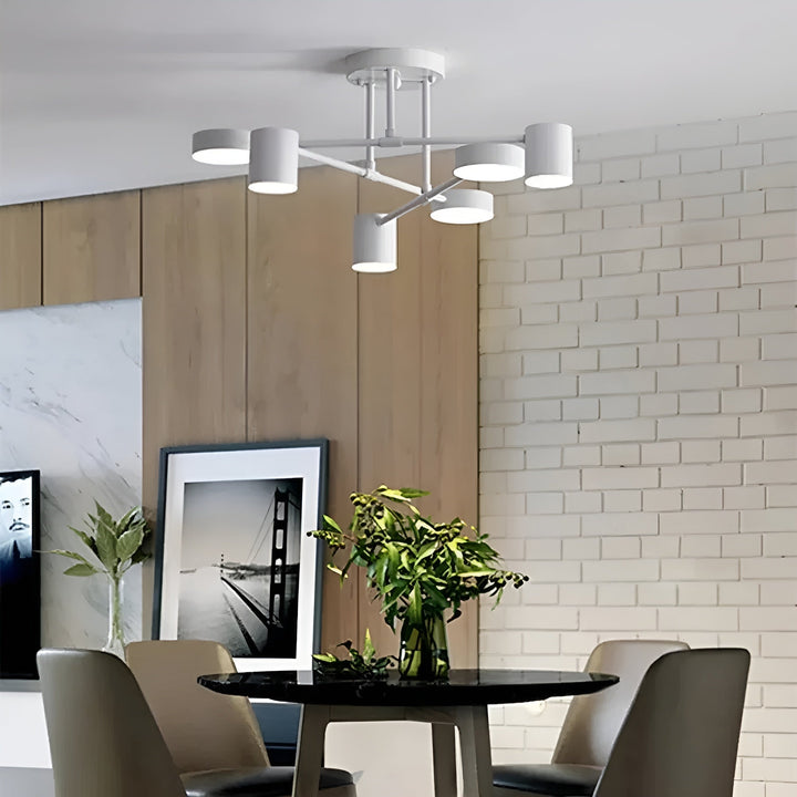 Vit LED-taklampa hängande ovanför ett matbord i en ljus miljö
