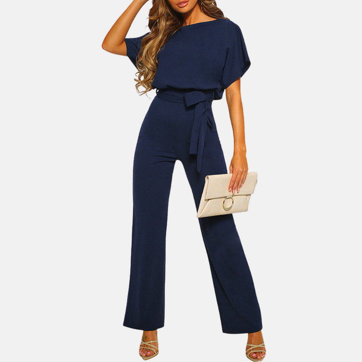 Mörkblå elegant damjumpsuit med vida ben och matchande midjeband
