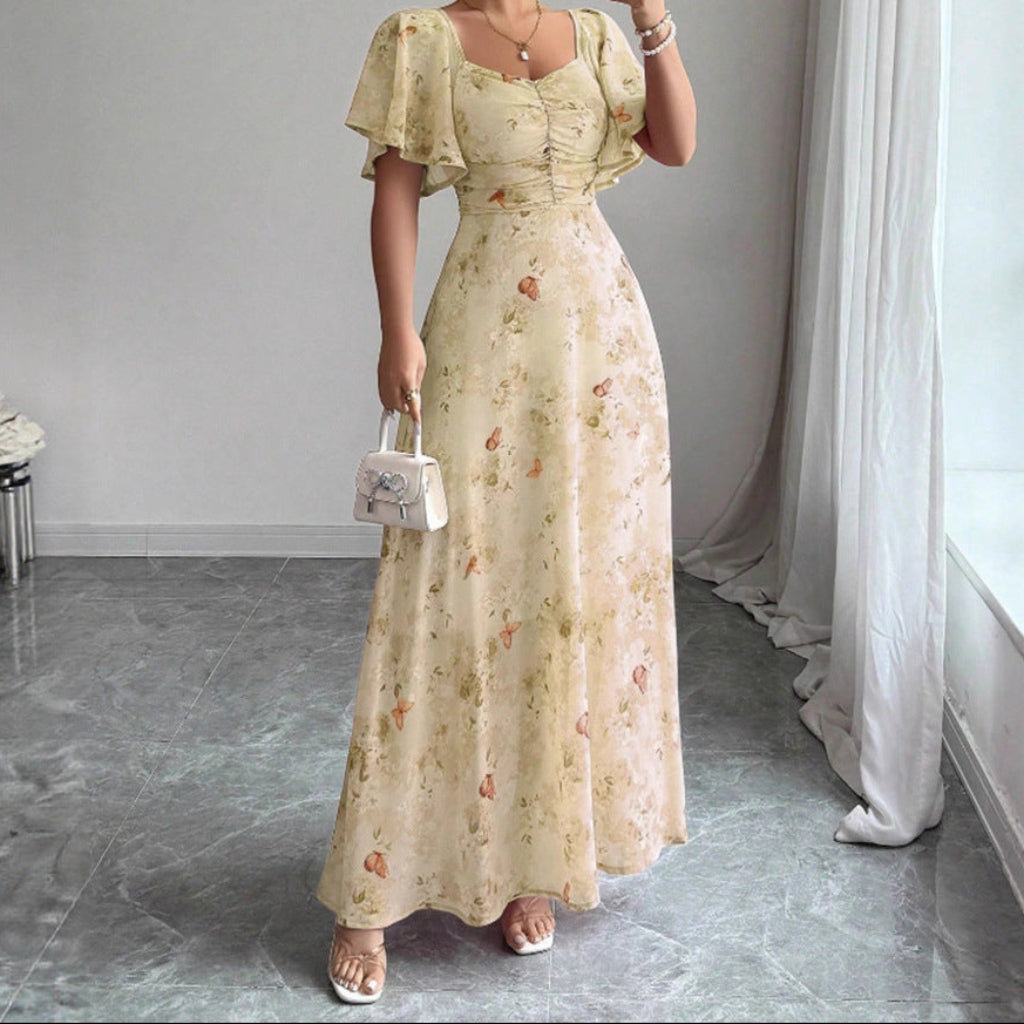 Elegant blommik sommarklänning för damer med vackra lotusärmar i helfigur