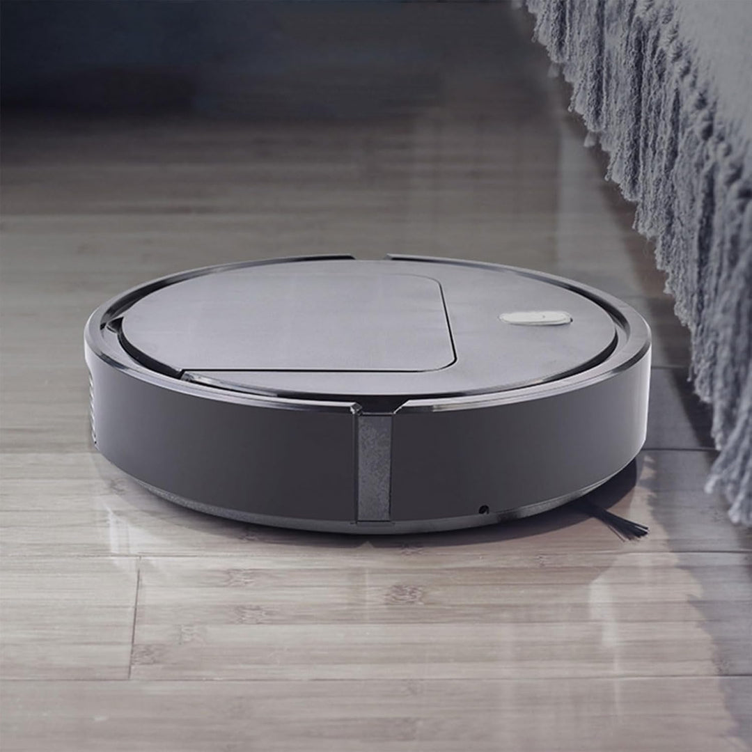Smart 3-i-1 städrobot sedd underifrån som visar suginlopp och drivhjul