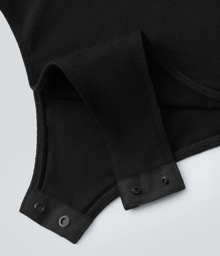 Svart långärmad body för dam med tight passform