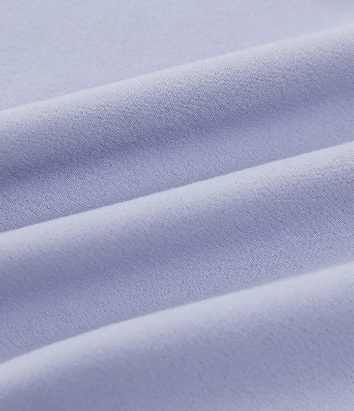 Detaljbild på midja med knytning på funktionella yogaleggings