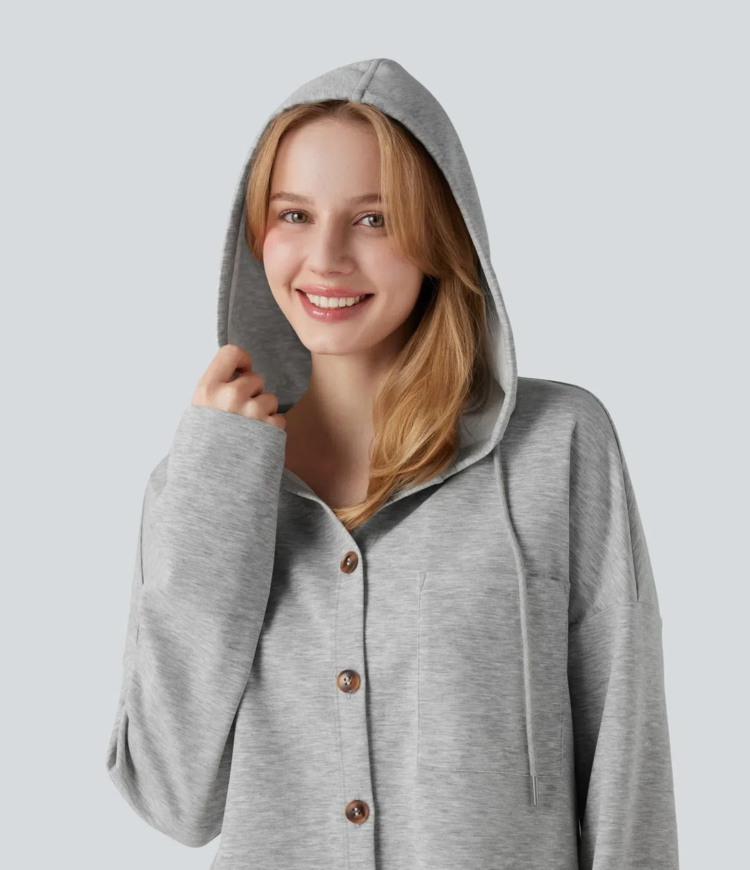Grå dam sweatshirt med huva och dragsko, visad bakifrån