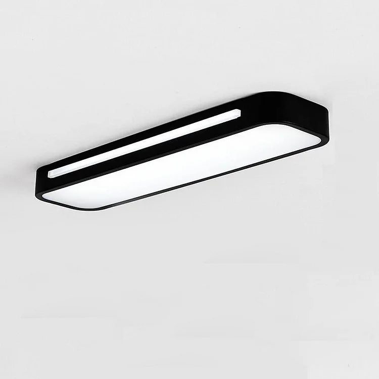 Minimalistisk taklampa som sprider behagligt ljus i vardagsrummet