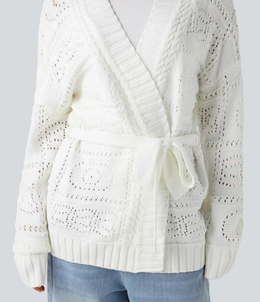 Stickad damcardigan med lång ärm och knytbälte i beige