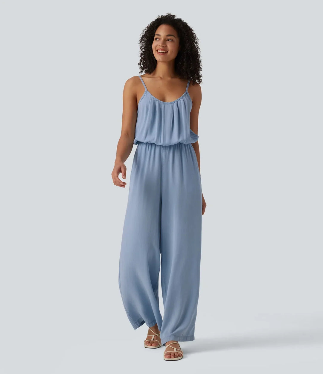 Blå vardagsjumpsuit för dam med praktiska sidofickor