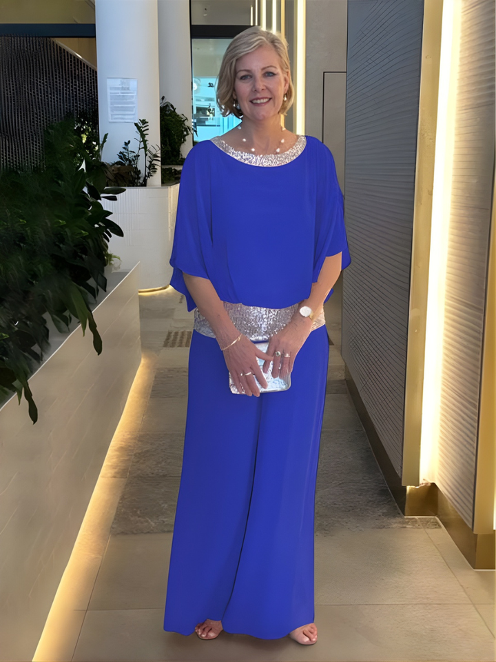 Elegant festblus med vida byxor i matchande dammodell