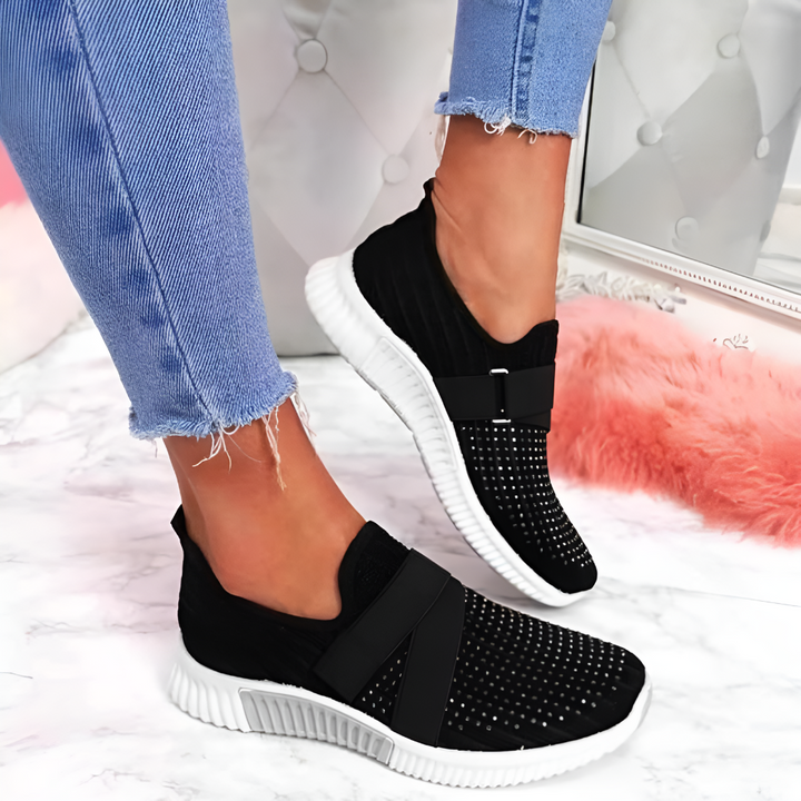Svart stickade slip-on träningsskor för dam med vit sula