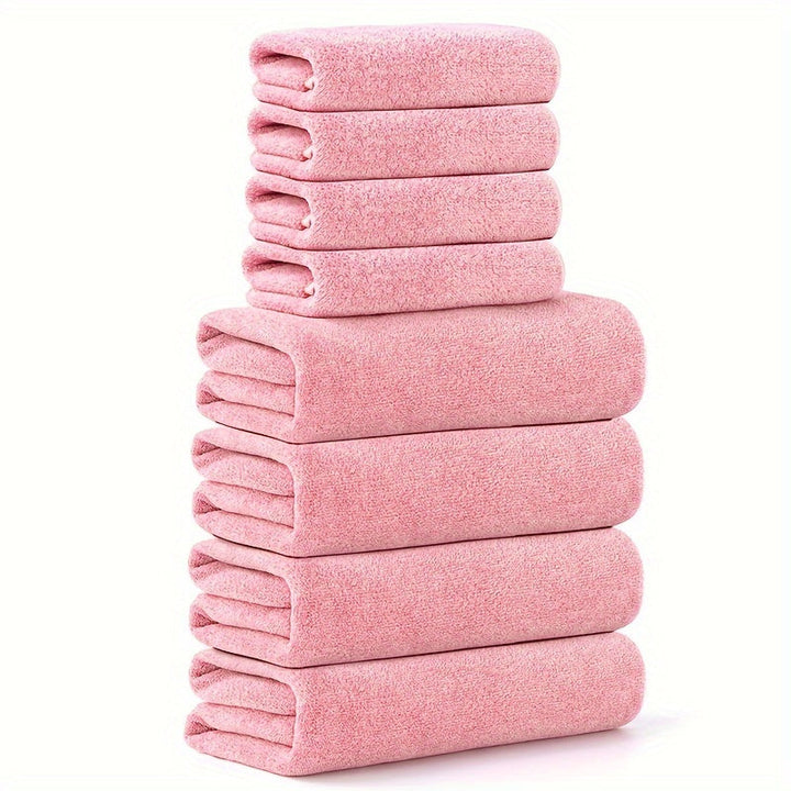 Staplade rosa handdukar i olika storlekar