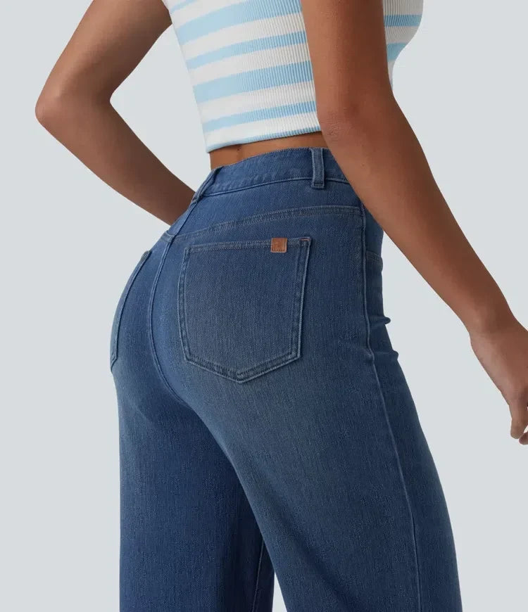 Närbild på knapp och dragkedja i midjan på damjeans