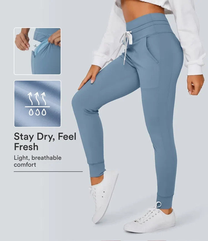 Dam joggers i blått med hög midja och praktisk ficka