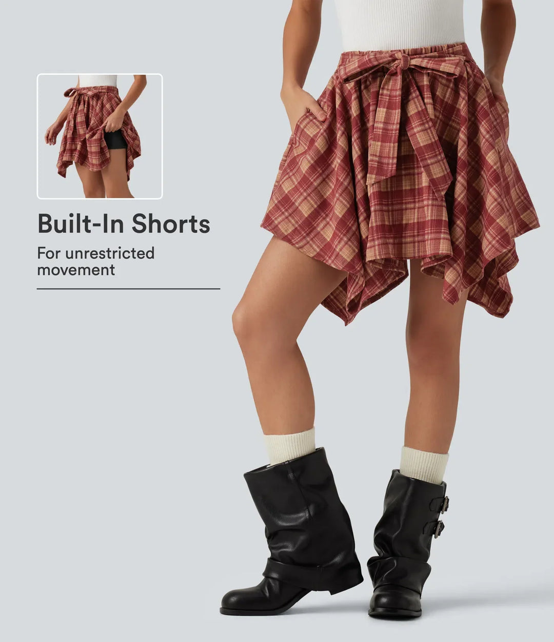 Detaljbild på rutigt tyg och hög midja på damkjol med shorts