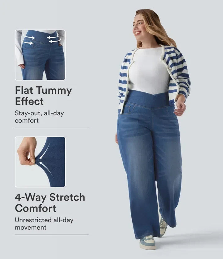 Plusstorleksmodell i blå crossover-jeans med hög midja och raka ben