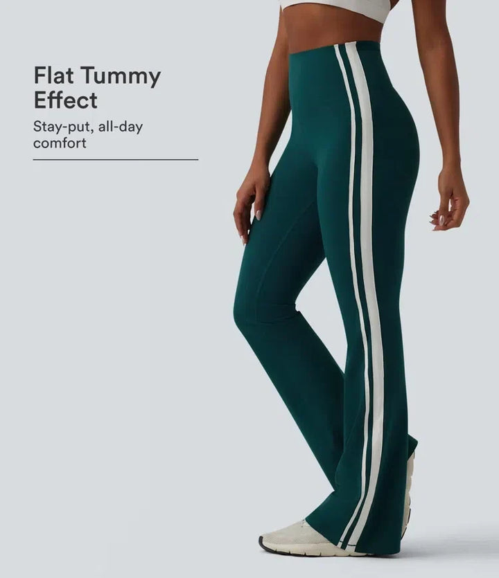 Mörkgröna utsvängda yogaleggings med hög midja och vita sidoränder