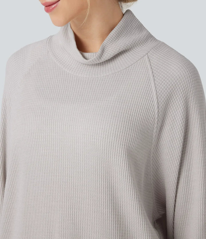 Grön sweatshirt för dam med strukturerat våffeltyg och långärmad design med tumhål