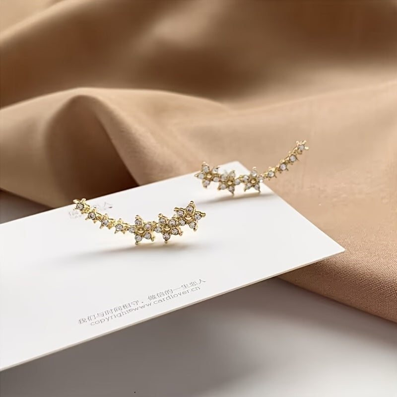 Exklusiva smycken, blommiga örhängen med blank finish