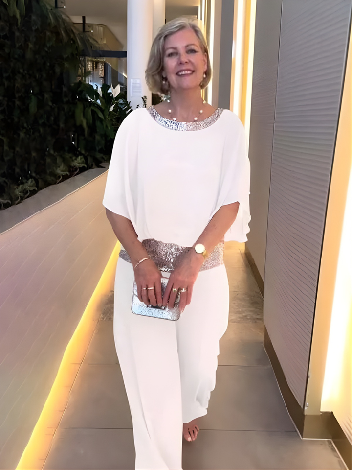 Snygg kvällslook med elegant blus och vida byxor