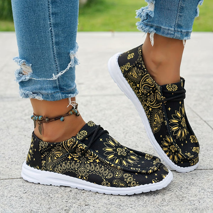 Ortopediska sneakers för dam som visar ovandelens ventilerande tyg