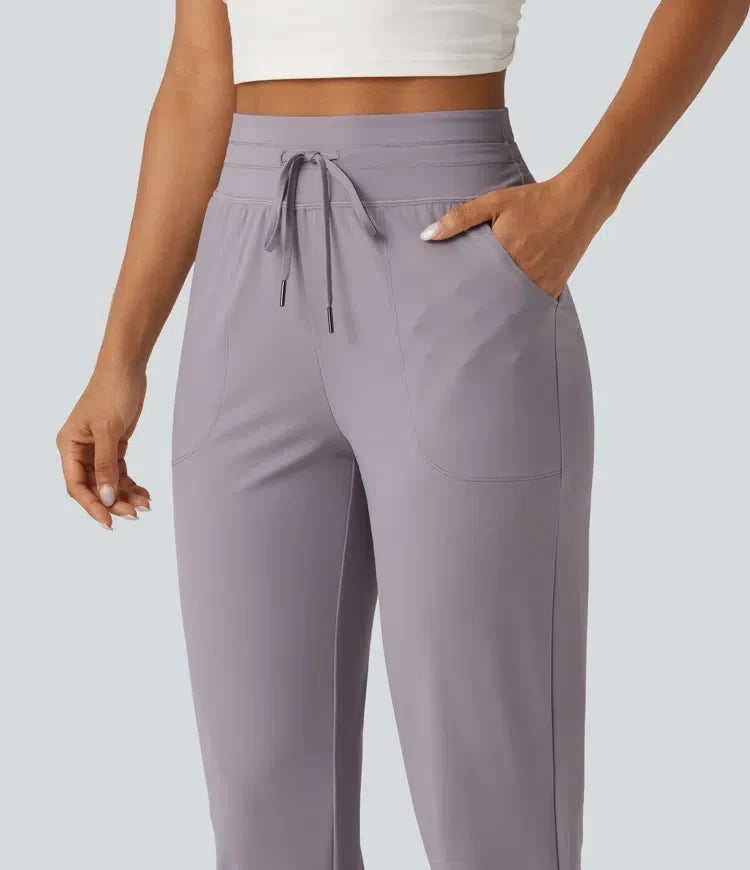 Högmidjade dam joggers med rynkad detalj och fickor för träning och vardag