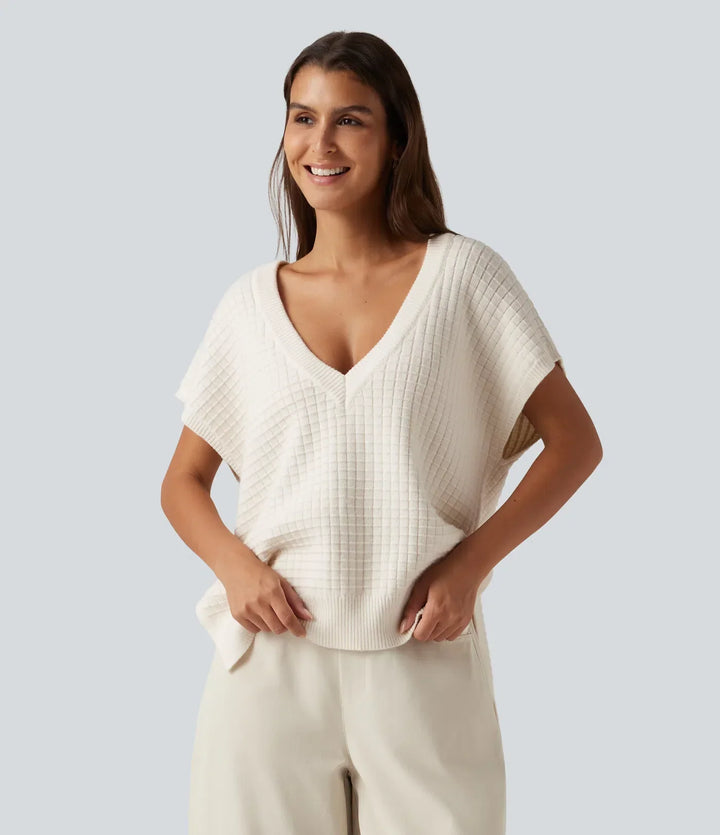 Elegant tröjväst för damer med v-ringad design bakifrån