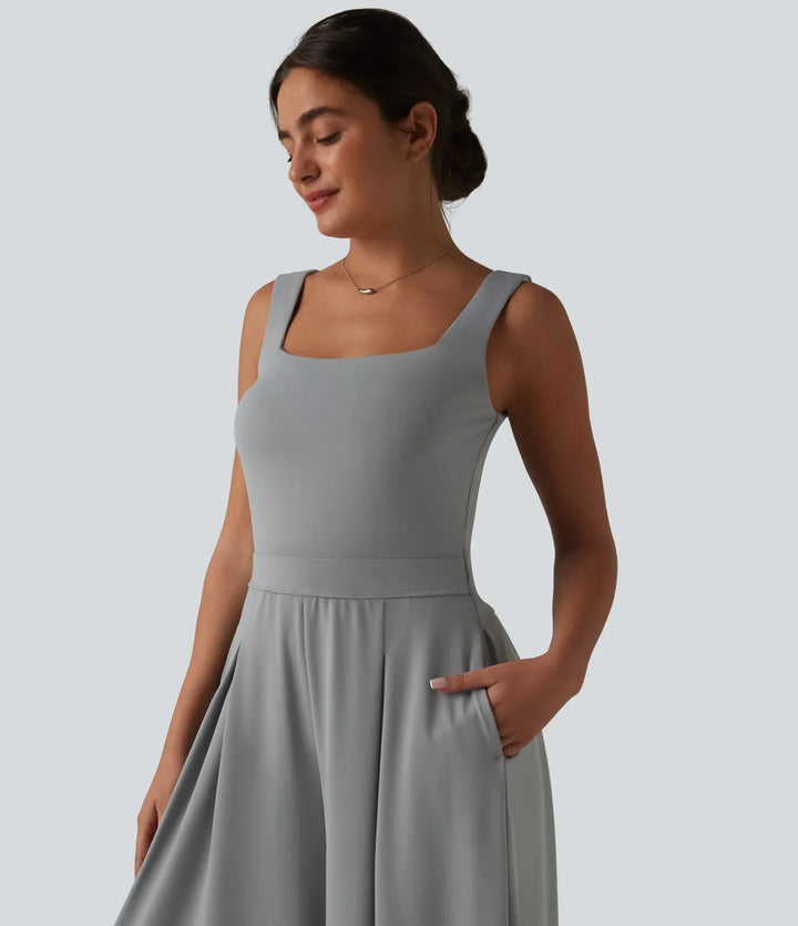 Elegant svart damjumpsuit med fyrkantig hals och vida ben
