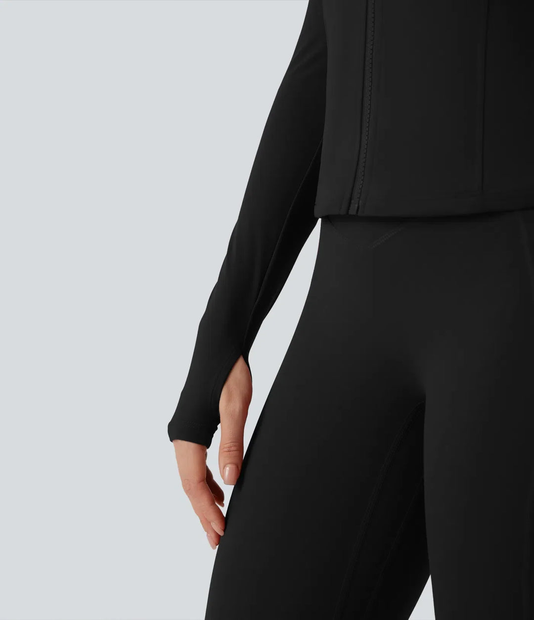 Fitnesskläder för dam: grå yogajacka med tumhål och dragkedja