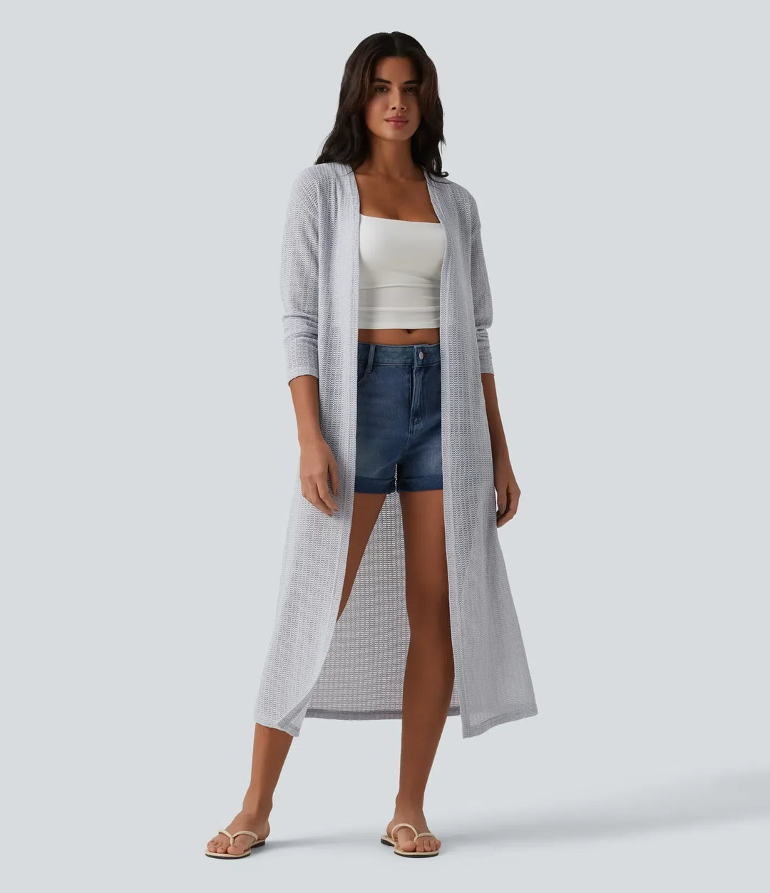 Helhetsbild av elegant lång stickad kappa för damer inom vardagsmode