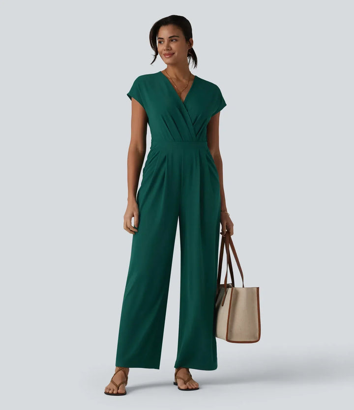 Grön kortärmad arbetsjumpsuit för kvinnor, visad bakifrån med passform