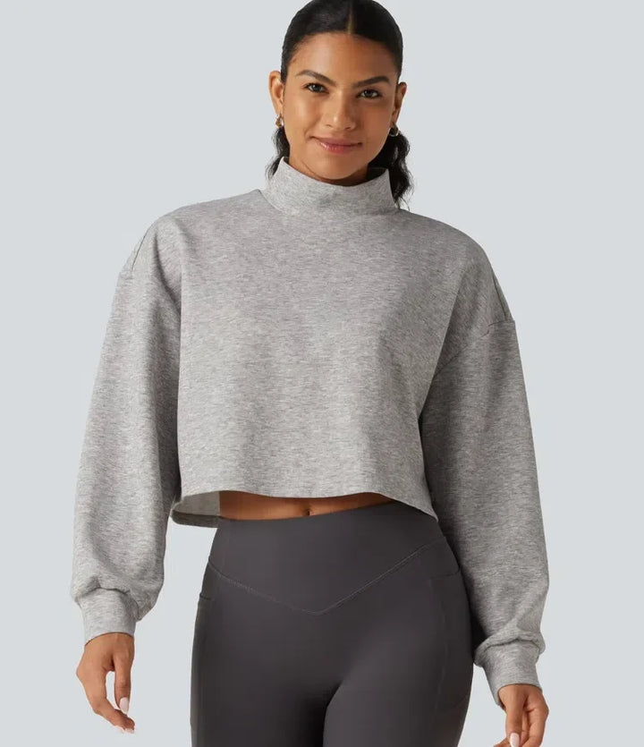 Croppad damtröja med lång ärm och halvpolo i mjukt material