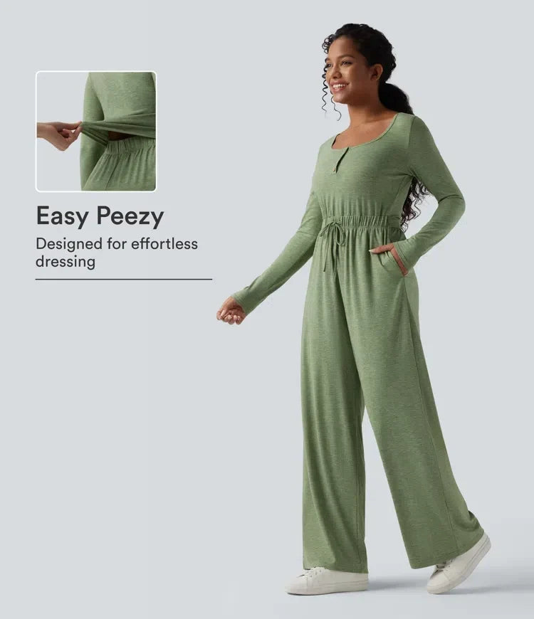 Grön långärmad damjumpsuit med dragsko och praktiska fickor