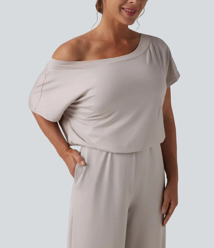 Stilren vardagsjumpsuit för dam med modern slits och fickdetaljer
