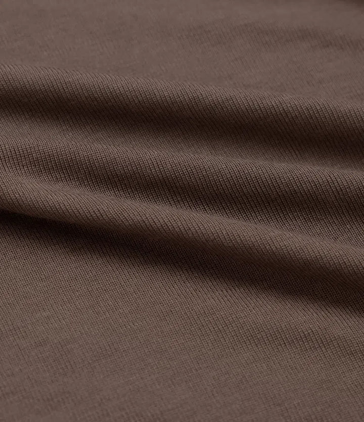 Svart långärmad t-shirt för dam i asymmetrisk vardagsstil