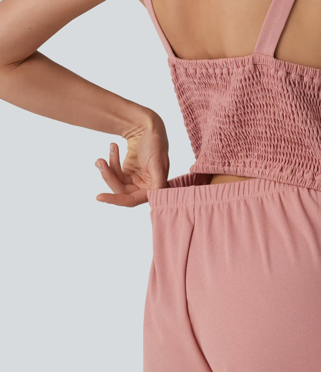 Ärmlös jumpsuit för dam med knappar framtill och vida ben