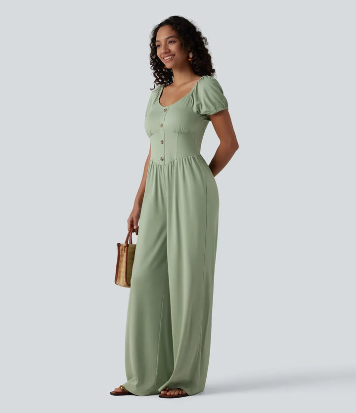Närbild på korsettdetalj och struktur på svart damjumpsuit