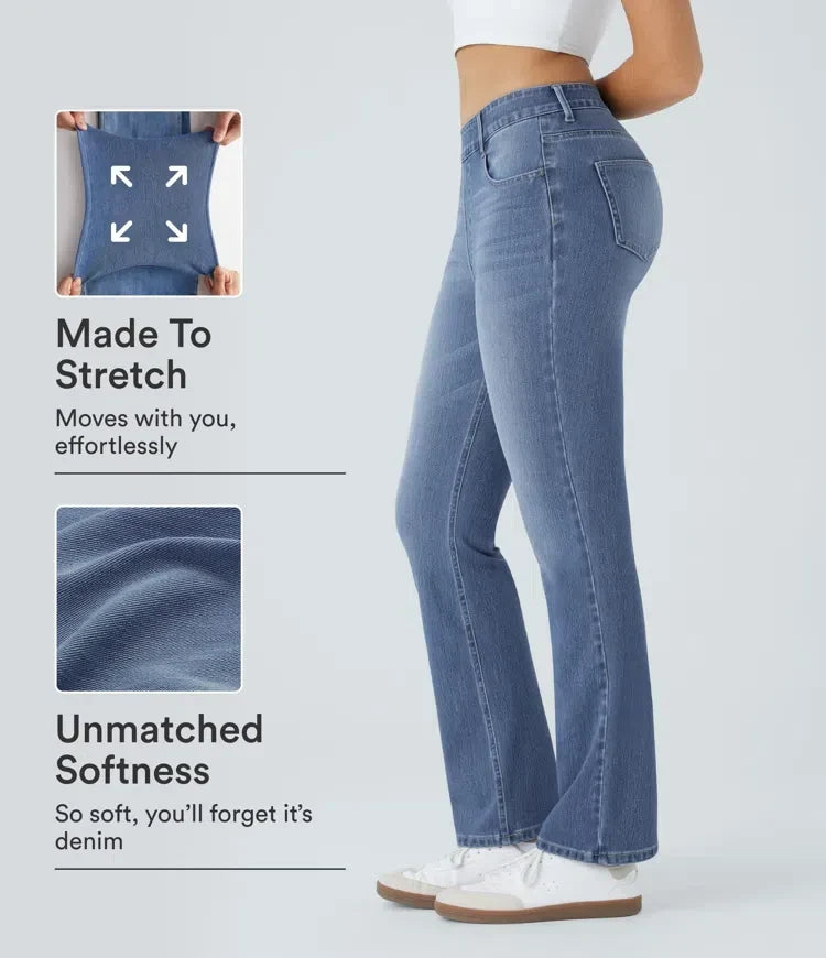 Kvinna som visar stretch och mjukhet på damernas blå bootcut-jeans