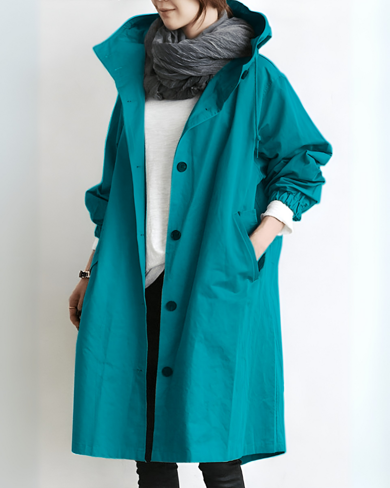 Beige trenchcoat för dam med huva och knappar, helfigur