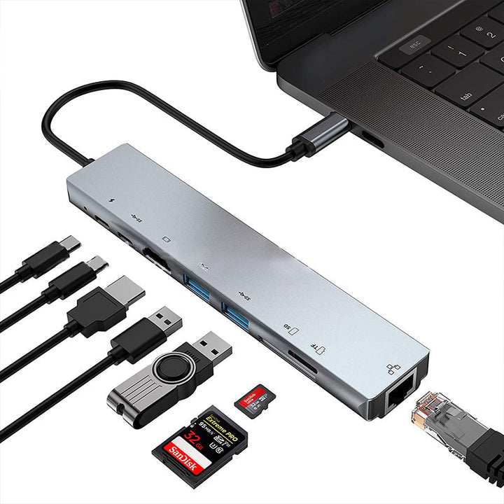 "8 i 1 USB-C dockningsstation i aluminium, modern design med flera portar för effektiv dataöverföring och laddning."